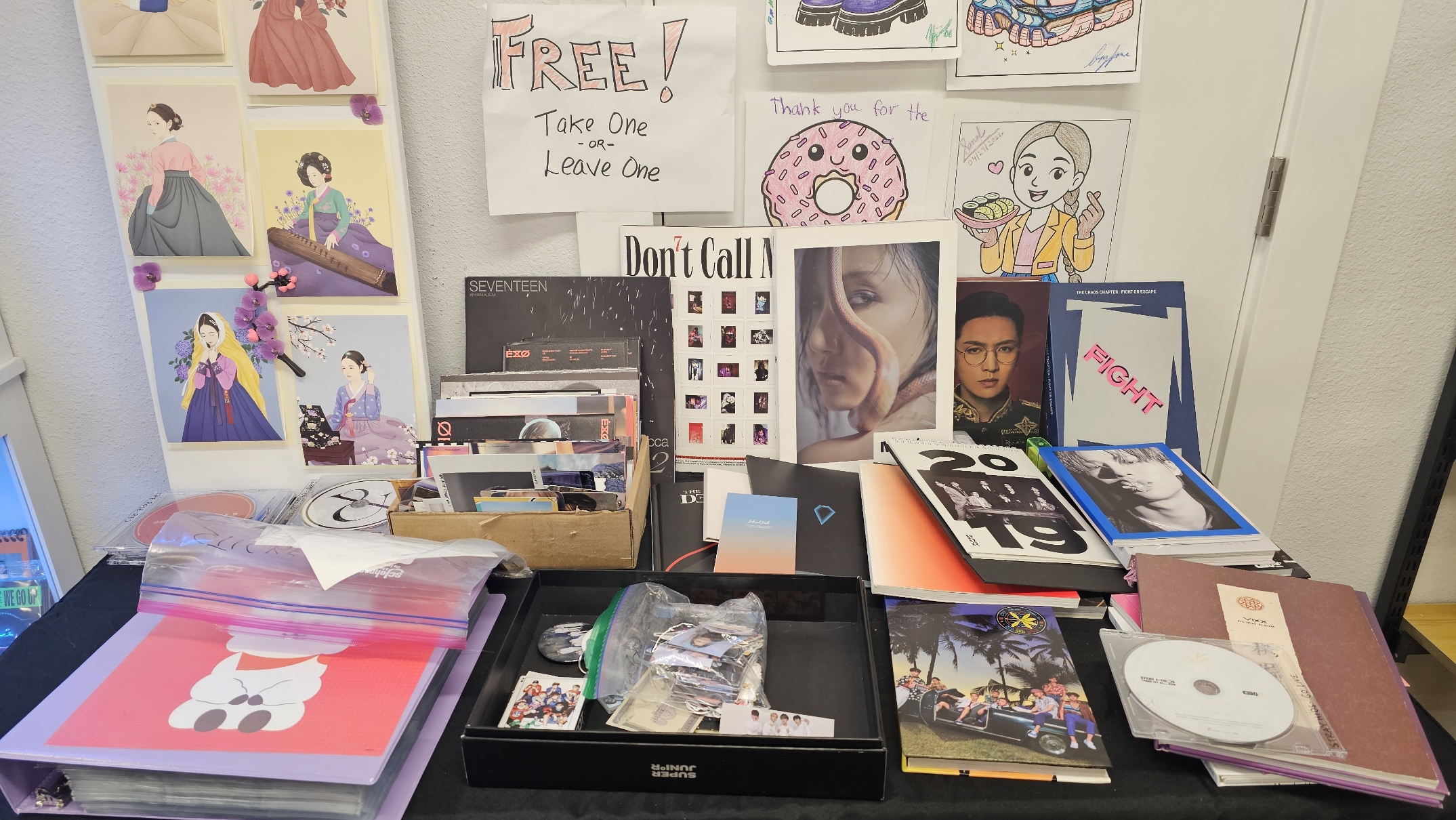Free merch table at SnowMoon K-Pop Cafe